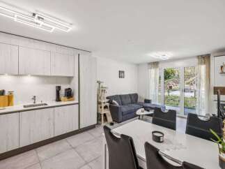 This modern property boasts a stylish open-plan living space, perfect for entertaining.