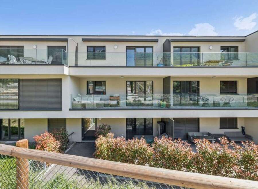 Discover modern living in this stunning property featuring sleek glass balconies and contemporary design.