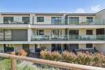 Discover modern living in this stunning property featuring sleek glass balconies and contemporary design.