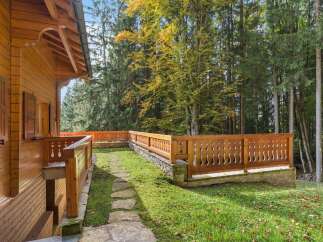 Discover the charm of this stunning wooden property nestled in a serene, wooded setting.