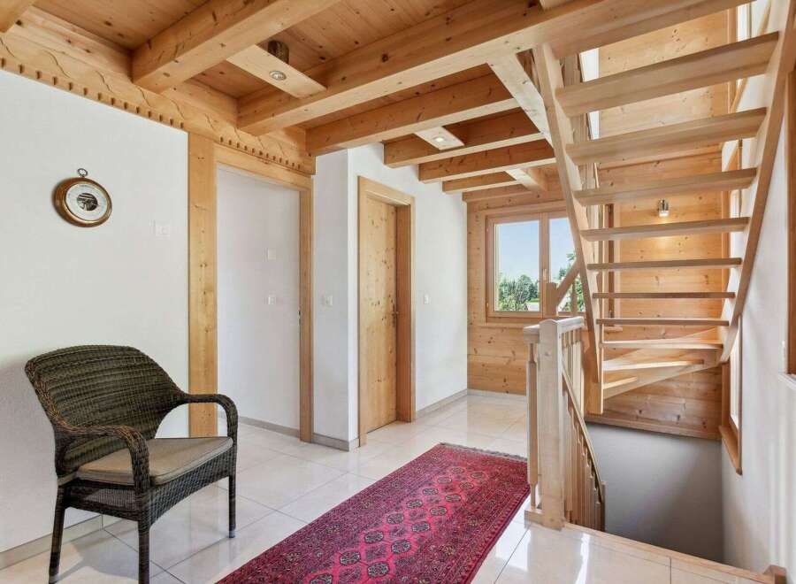 Step into this inviting home with its warm wooden accents and a touch of rustic charm.