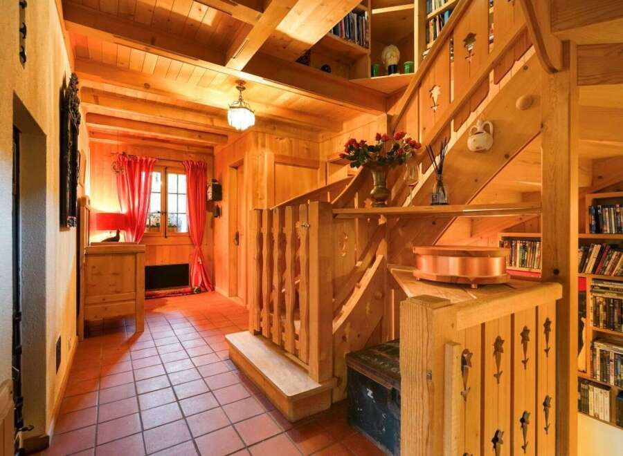 Step into a world of rustic charm with this stunning property, featuring exquisite wooden details throughout.