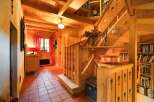 Step into a world of rustic charm with this stunning property, featuring exquisite wooden details throughout.