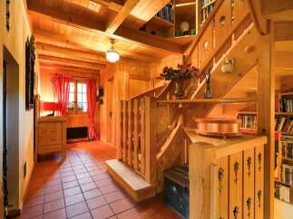Step into a world of rustic charm with this stunning property, featuring exquisite wooden details throughout.