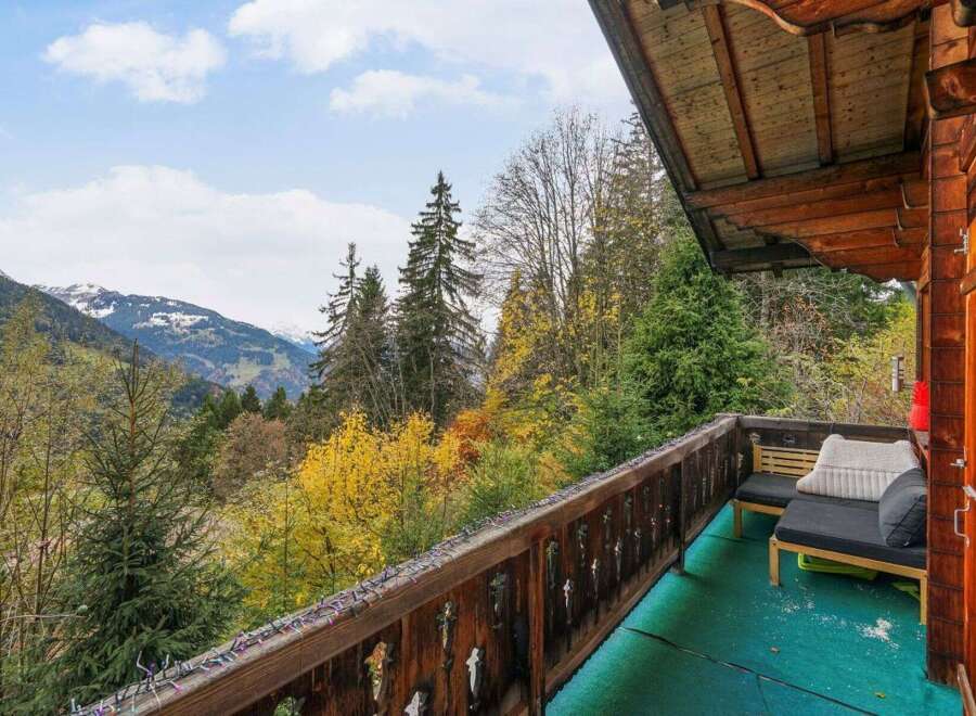 Enjoy breathtaking mountain views from this charming balcony.