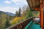 Enjoy breathtaking mountain views from this charming balcony.