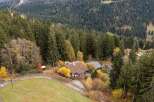 Nestled amidst a lush forest, this charming property offers a serene escape.