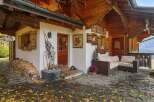 Discover the charm of this stunning property, featuring a cozy outdoor seating area perfect for relaxation.