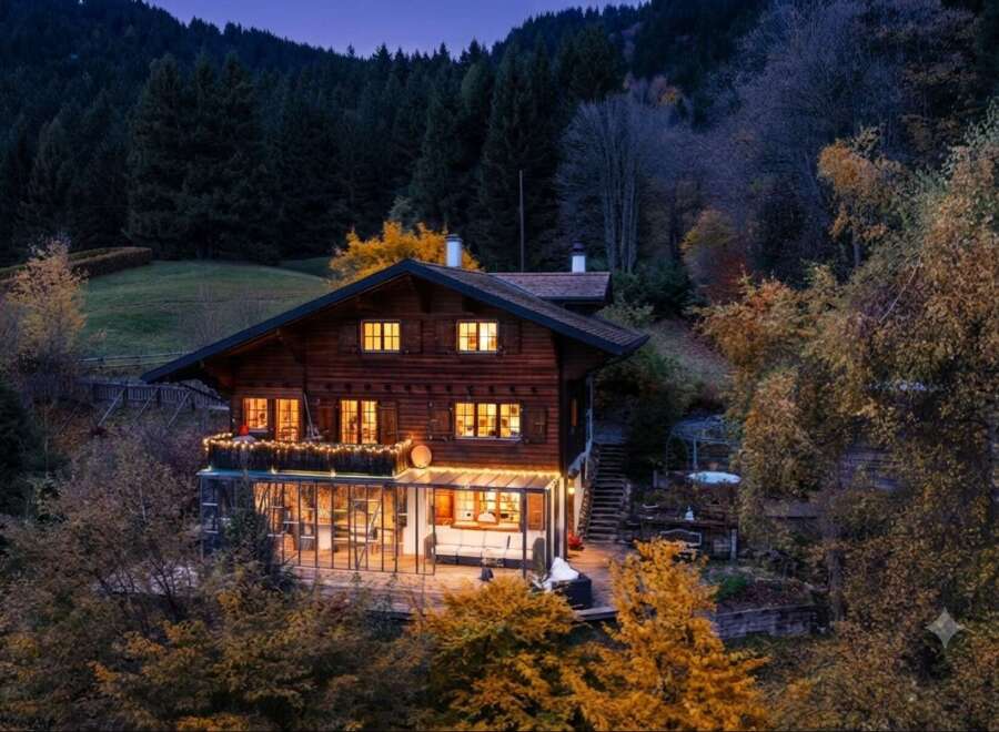 Nestled amidst a serene forest, this charming wooden chalet offers a cozy retreat with its warm, inviting interior and stunning natural surroundings.