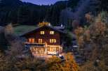 Nestled amidst a serene forest, this charming wooden chalet offers a cozy retreat with its warm, inviting interior and stunning natural surroundings.