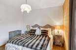 Experience the epitome of comfort and style in this beautifully designed bedroom.