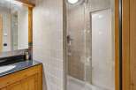 Step into this beautifully designed bathroom featuring a modern glass shower enclosure.