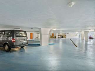 Discover the convenience of this well-lit parking garage, perfect for secure vehicle storage.