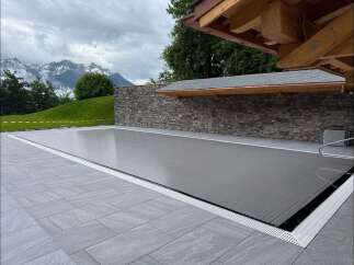 Enjoy luxurious outdoor living with this stunning property featuring a sleek pool and a modern design.