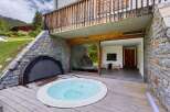 Experience luxury living with this stunning property featuring a private hot tub and a spacious outdoor deck.