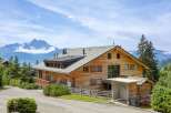 This stunning wooden chalet offers breathtaking mountain views and a serene atmosphere.