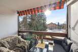 Enjoy breathtaking views from this charming balcony! This property features a cozy seating area, perfect for relaxing and soaking up the sun.