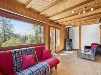 Experience the charm of this cozy cabin with stunning mountain views.