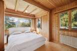 Experience the tranquility of this stunning bedroom with breathtaking mountain views.