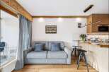 Discover this charming property featuring a cozy living space with a comfortable sofa and elegant curtains.