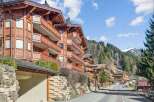 Discover the charm of this stunning property, featuring exquisite wooden architecture and balconies.