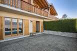 Discover the charm of this stunning property, boasting a beautiful wooden balcony and inviting outdoor space.