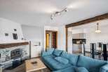This stunning property boasts a cozy living room with a beautiful fireplace, perfect for relaxing evenings.