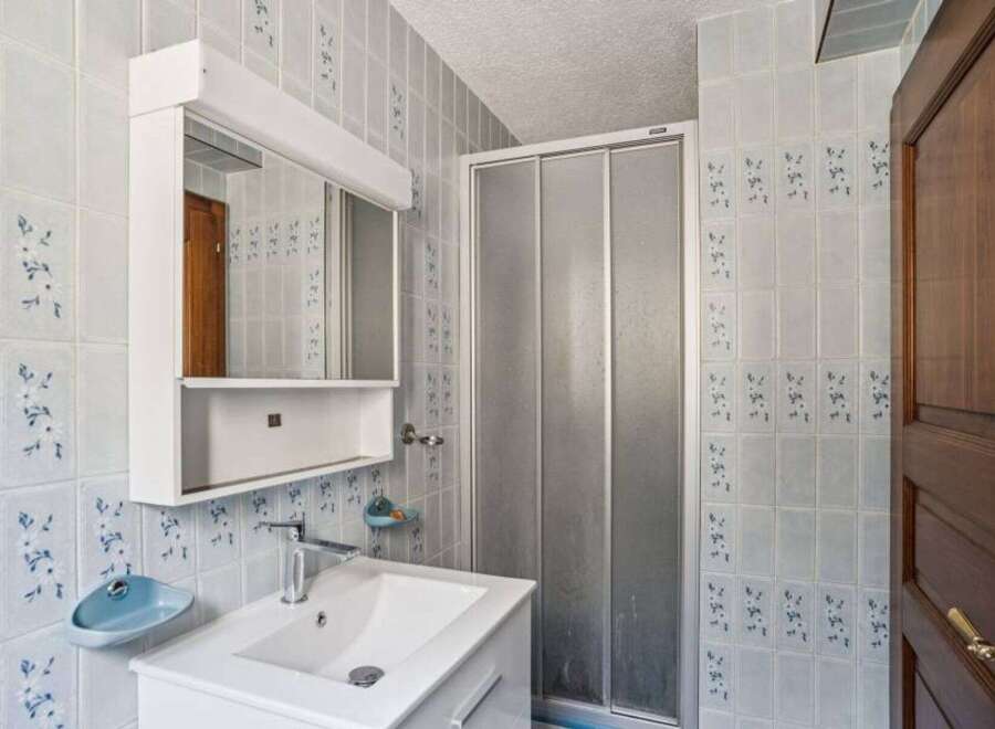 This charming bathroom features a bright and airy design, perfect for starting your day.