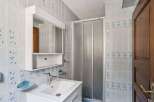 This charming bathroom features a bright and airy design, perfect for starting your day.