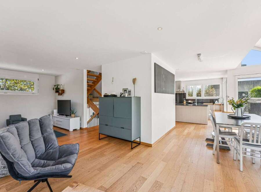 This stunning property boasts a modern open-plan living space with beautiful hardwood floors.