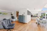 This stunning property boasts a modern open-plan living space with beautiful hardwood floors.
