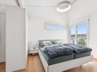 Experience modern living in this bright and airy bedroom.