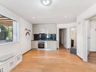 Discover this charming property featuring a modern kitchen with sleek cabinetry and appliances.