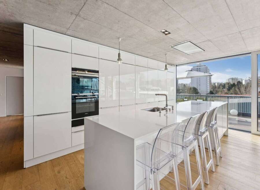 Experience modern luxury in this stunning kitchen! Featuring sleek white cabinetry, a spacious island, and high-end appliances, this space is perfect for both cooking and entertaining.