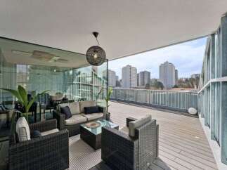 Experience luxury living with this stunning property featuring a spacious outdoor terrace.