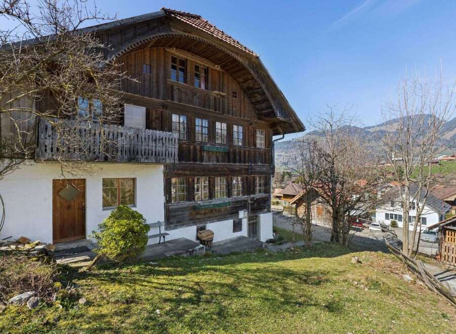 This charming wooden house offers a unique blend of rustic charm and modern comfort.