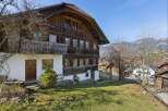 This charming wooden house offers a unique blend of rustic charm and modern comfort.
