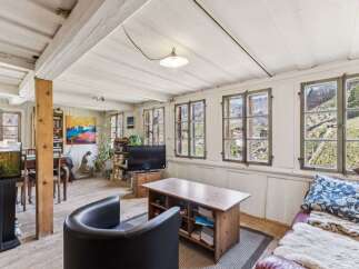 Step into a charming living space with rustic elegance.