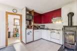 This charming kitchen features a unique blend of vintage and functional design.