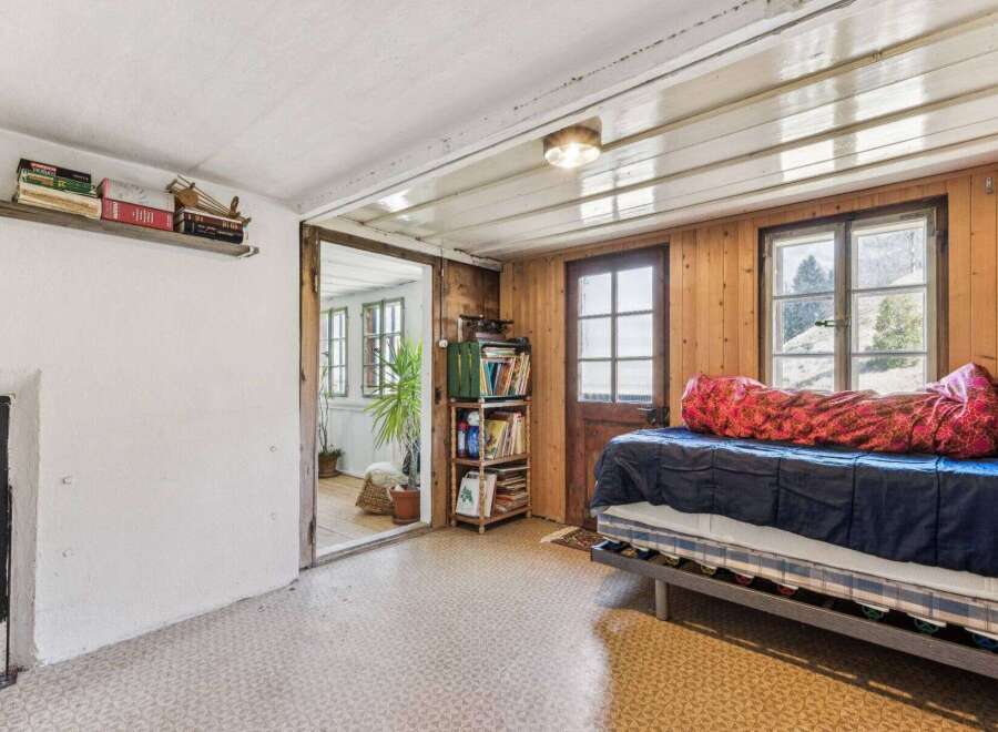 Discover the charm of this cozy cabin retreat, featuring rustic wooden walls and a welcoming atmosphere.