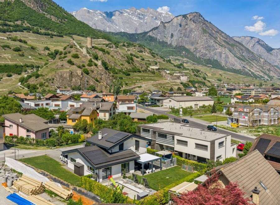 Discover your dream home in this picturesque mountain town! This stunning property boasts modern architecture, solar panels, and a beautifully landscaped yard.