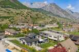 Discover your dream home in this picturesque mountain town! This stunning property boasts modern architecture, solar panels, and a beautifully landscaped yard.