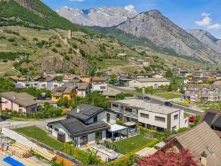 Discover your dream home in this picturesque mountain town! This stunning property boasts modern architecture, solar panels, and a beautifully landscaped yard.