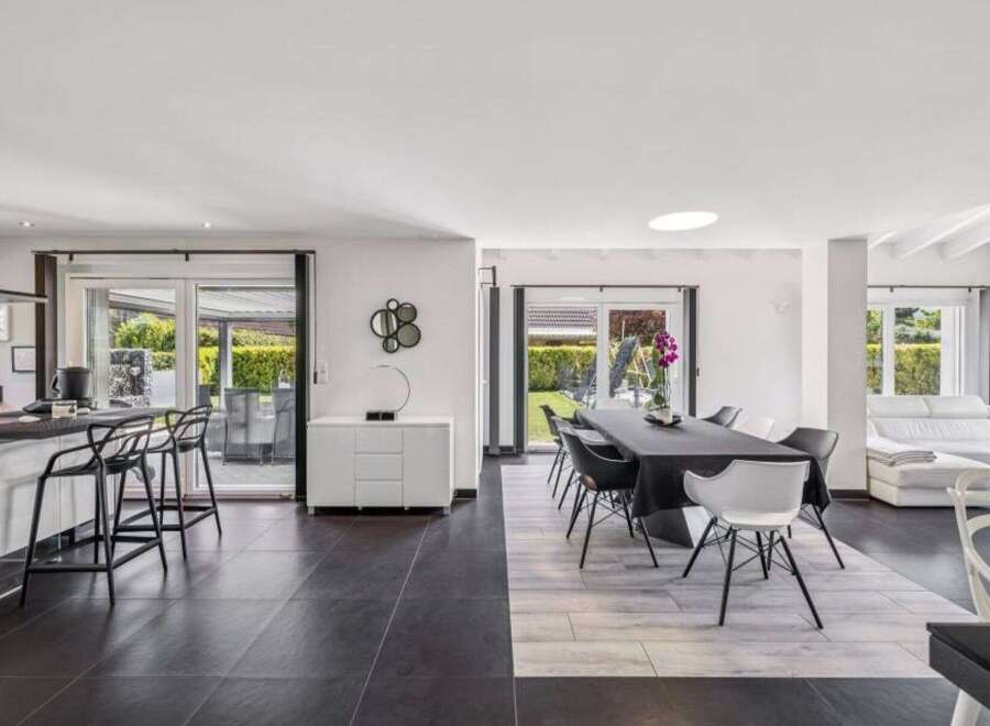This stunning property boasts a modern open-plan living space, perfect for entertaining.