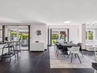 This stunning property boasts a modern open-plan living space, perfect for entertaining.