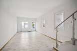 Discover the elegance of this bright and airy living space, featuring pristine white walls and a modern aesthetic.