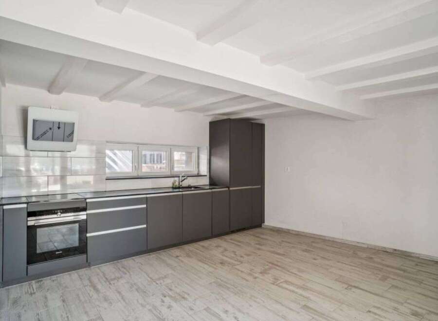 Discover modern living in this stylish kitchen! Featuring sleek cabinetry, a built-in oven, and a contemporary design, this space is perfect for culinary enthusiasts.