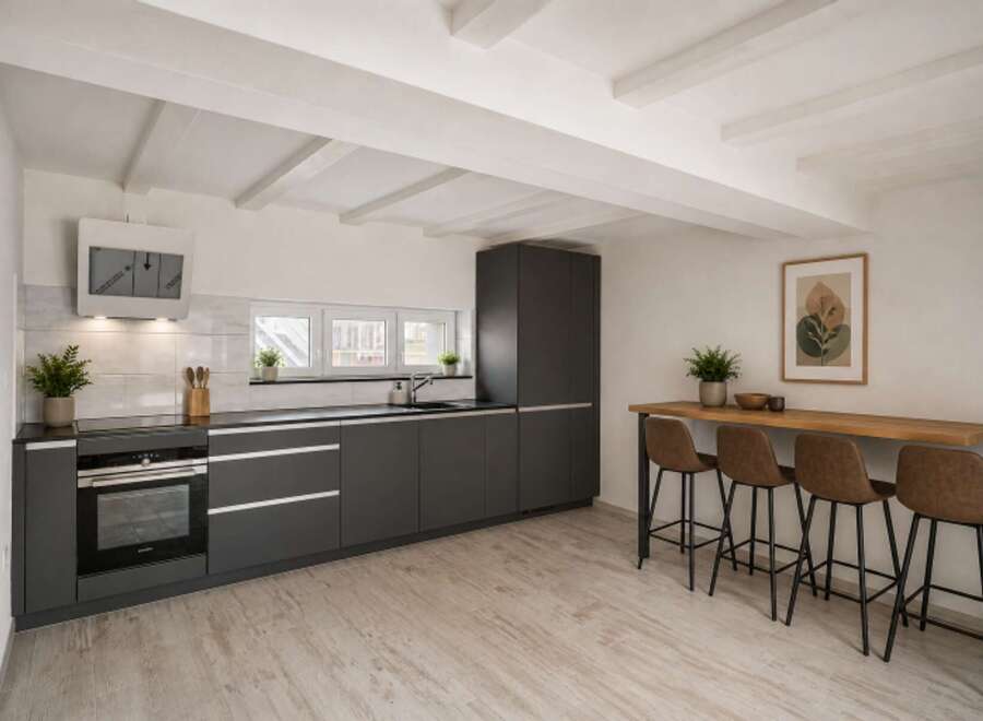 Discover modern living in this stylish kitchen! Featuring sleek, dark cabinetry, a built-in oven, and a contemporary design, this space is perfect for culinary enthusiasts.