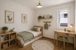 This charming bedroom offers a cozy and inviting space, perfect for a child.