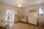 Step into a serene nursery designed for comfort and style.